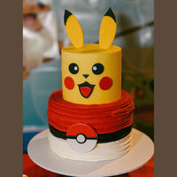 Two-tiered cake designed like Pikachu from Pokémon, with yellow top and red bottom.