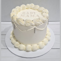 White cake with decorative elements on a white background